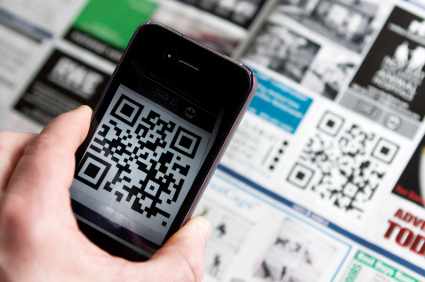 a person scans a QR code with a mobile device