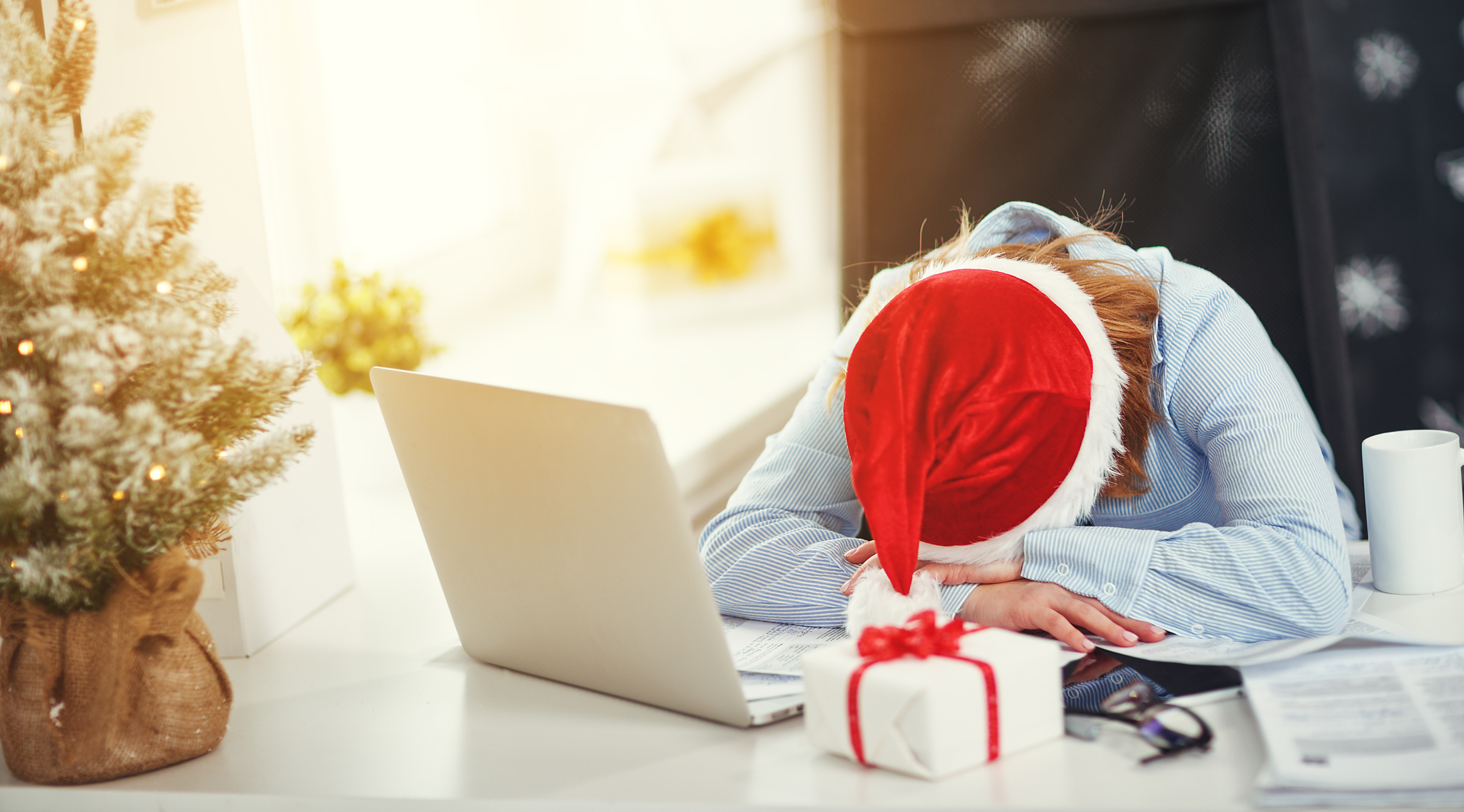 Frustrated holiday shopper in front of laptop