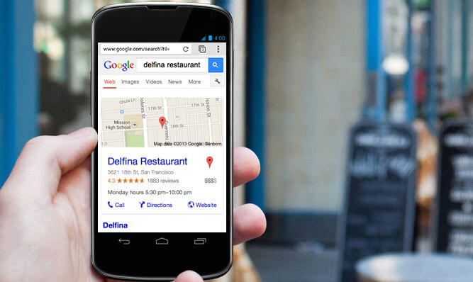 Mobile phone with Google business listing displayed